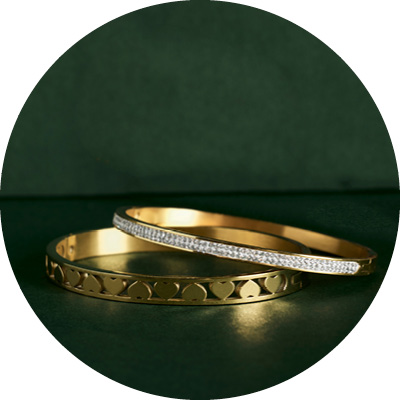 Guess stalen goldplated bangle 4G logo